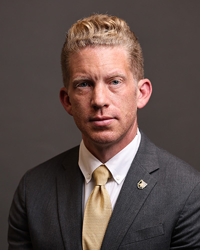 Senior Associate Director of Athletics, External Operations Thomas Theodorakis