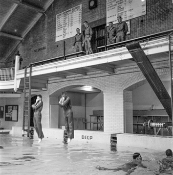 Jack Engeman, "Abandon ship" practice is a part of the cadet swimming program, ca. 1956