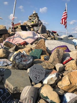 The large mound of stones that have been carried up the Trail of the Fallen and placed in memory of soldiers