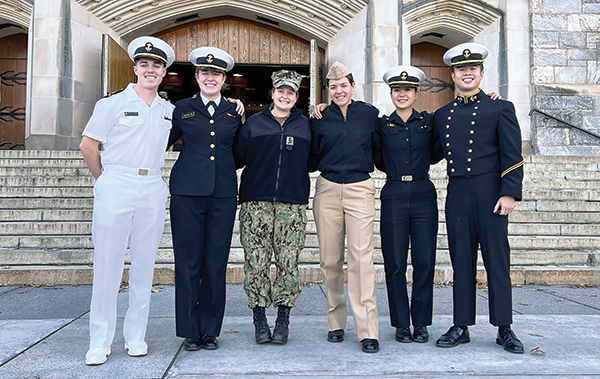 SAEP midshipmen from the U.S. Naval Academy pose on the Apron outside of Washington Hall.