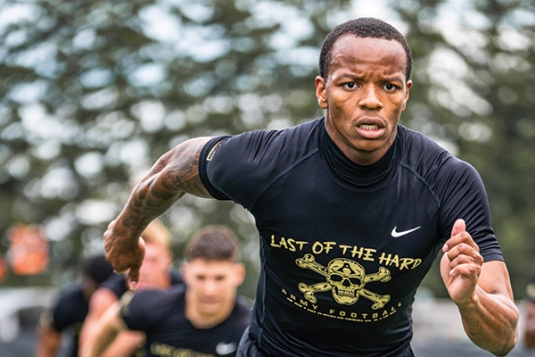 Members of the Army West Point Football Team conduct strength and conditioning drills during practice.