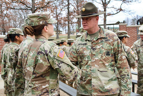SPC Daugherty shakes hands with her drill sergeant