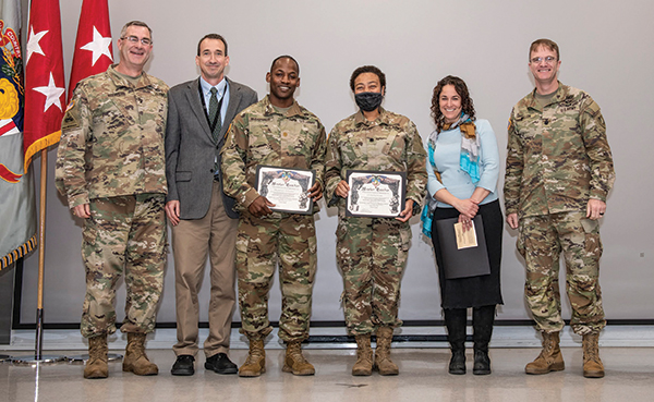 BG Shane Reeves ’96 (left), 15th Dean of the Academic Board, presents MTP certificates to faculty