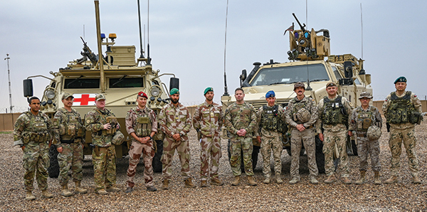 Then-LTC Lemler (seventh from left) led a team of over 3,100 people.