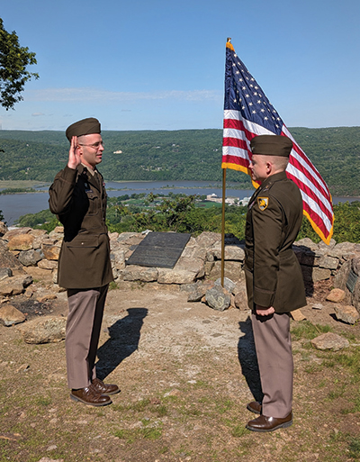 An officer taking the oath during a promotion ceremony from Redoubt 4.