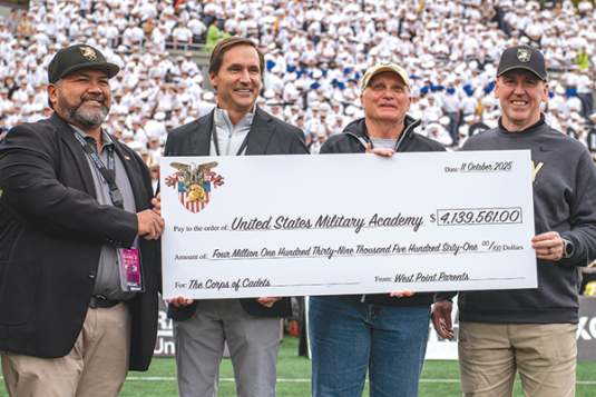 West Point Parents make gift at Army-Charlotte game